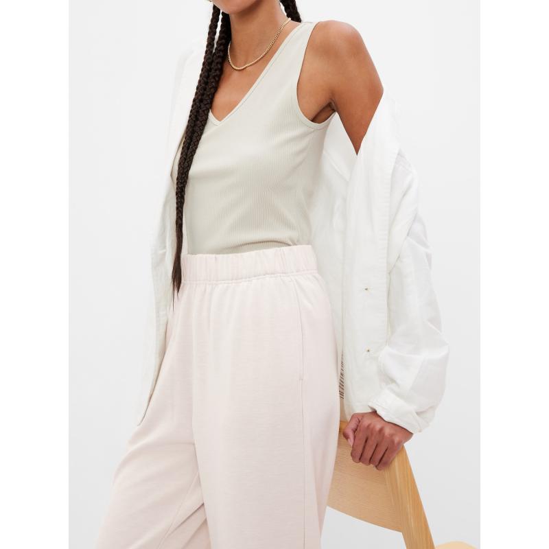 Egyenes, magasan felsliccelt melegítőnadrág