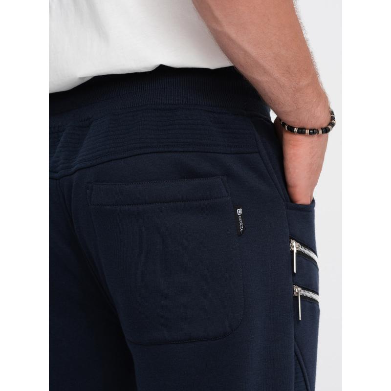 Pánske tepláky s ozdobnými zipsami V5 OM-PASK-22FW-012 tmavomodré