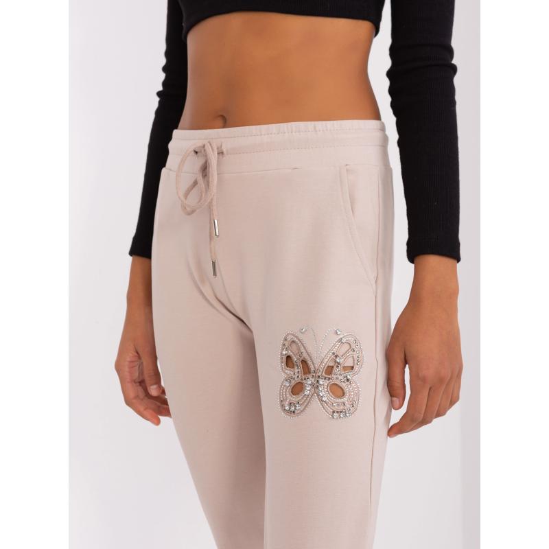 Dámské tepláky s průstřihy DIJ světle béžové 