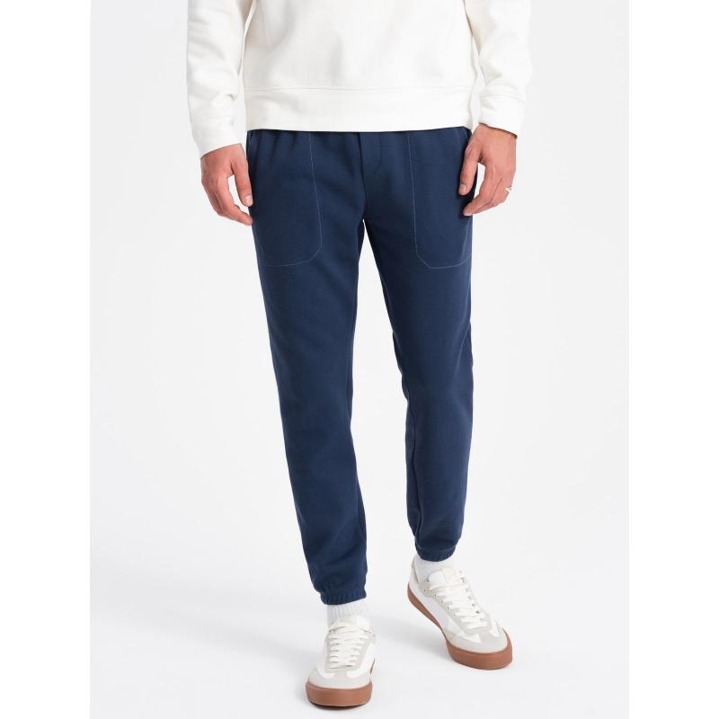 Pánské strukturované pletené tepláky CARROT tmavě modré 