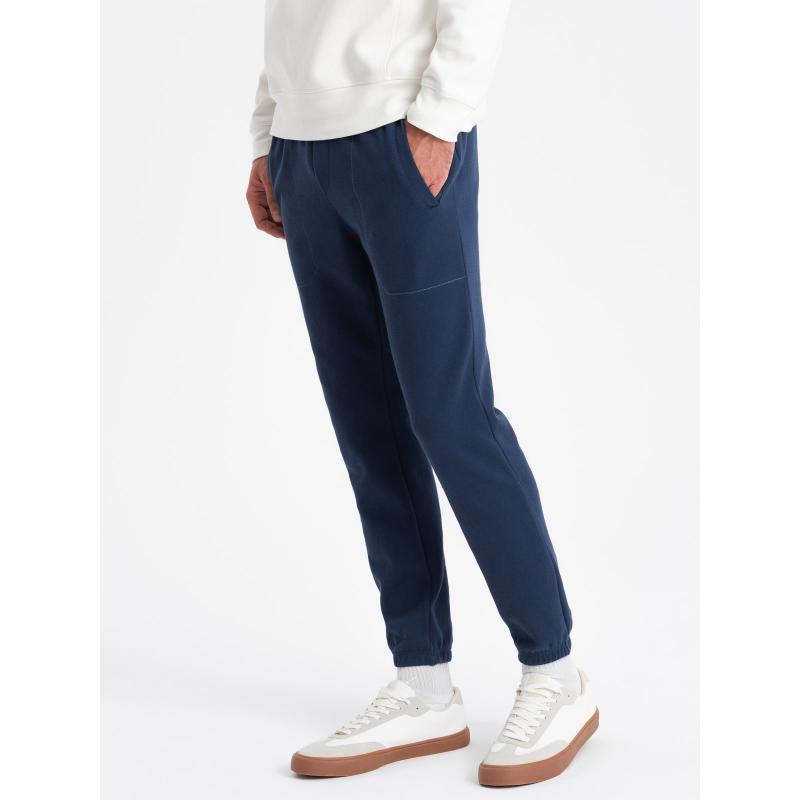 Pánské strukturované pletené tepláky CARROT tmavě modré 