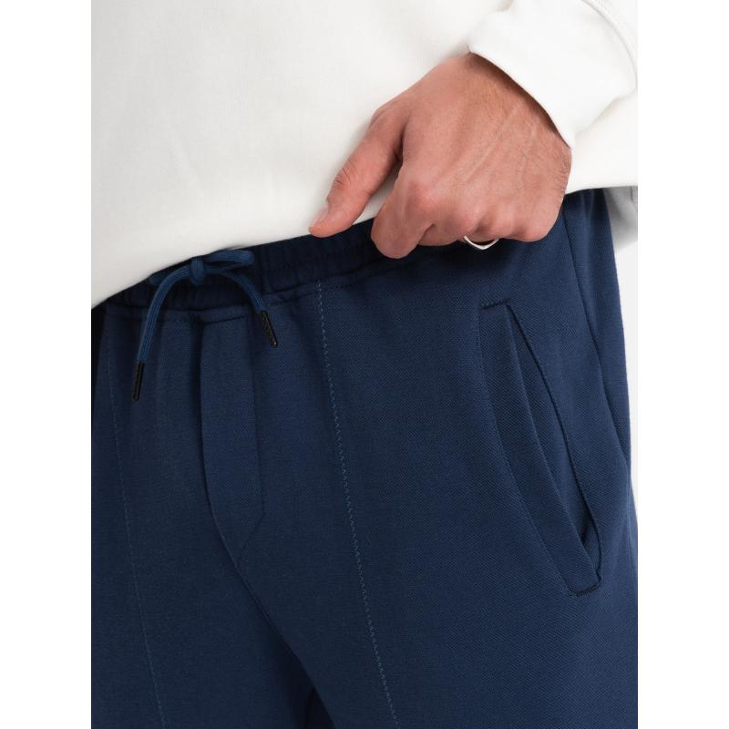 Pánské strukturované pletené tepláky CARROT tmavě modré 