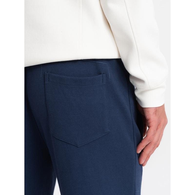 Pánské strukturované pletené tepláky CARROT tmavě modré 