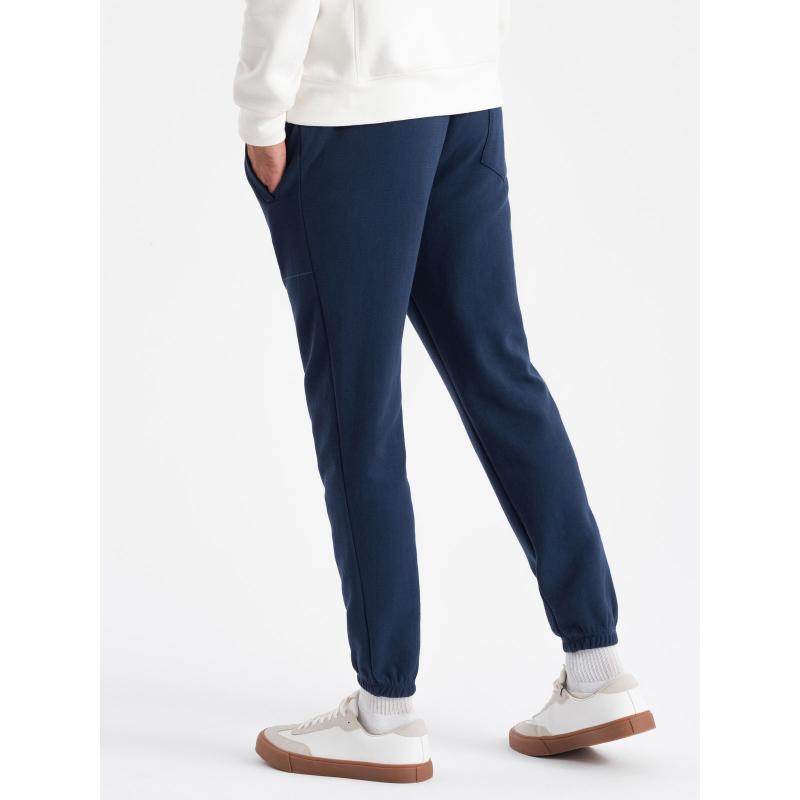 Pánské strukturované pletené tepláky CARROT tmavě modré 