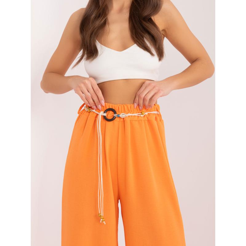 Dámské kalhoty z látky oranžové 
