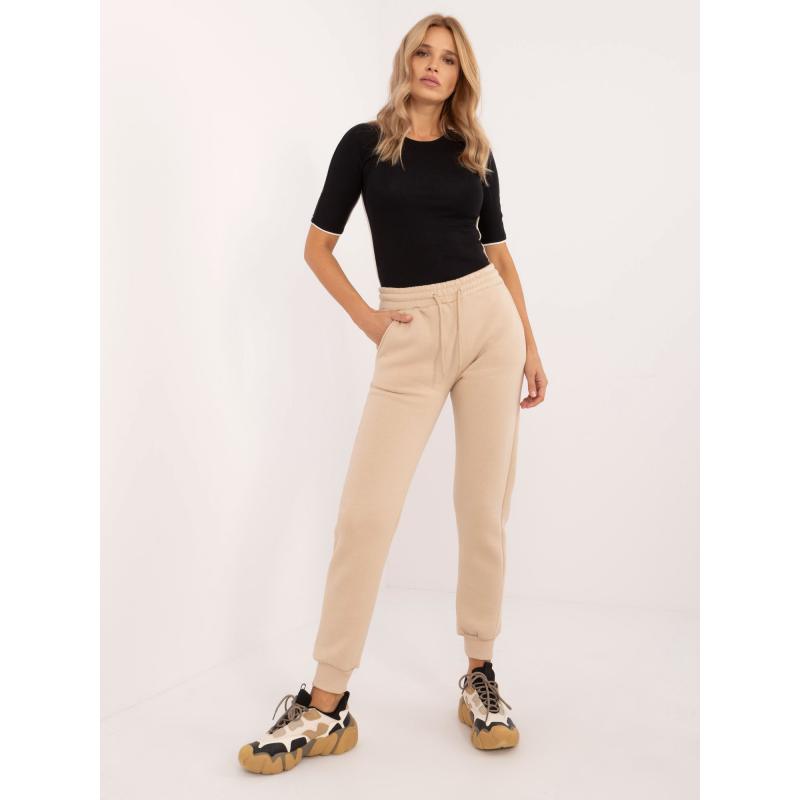 Női melegítőnadrág zsebekkel bézs színű