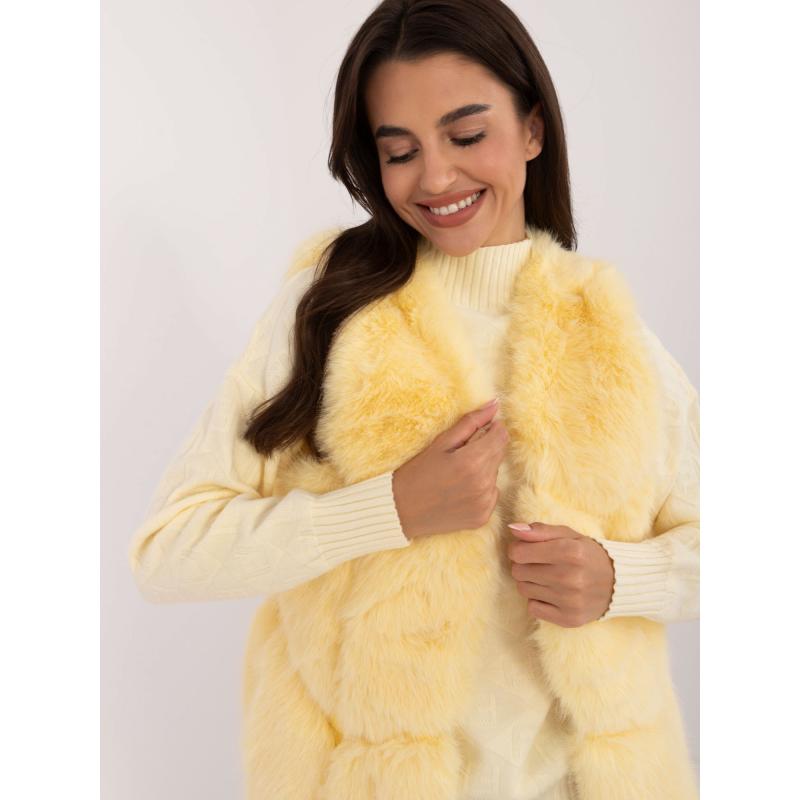 Dámská vesta s kožešinovou podšívkou světle žlutá 