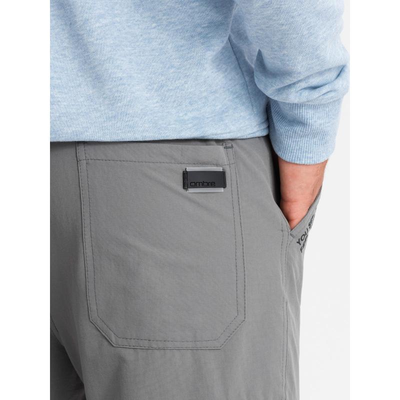 Pánské tepláky s cargo kapsami a potiskem - šedé