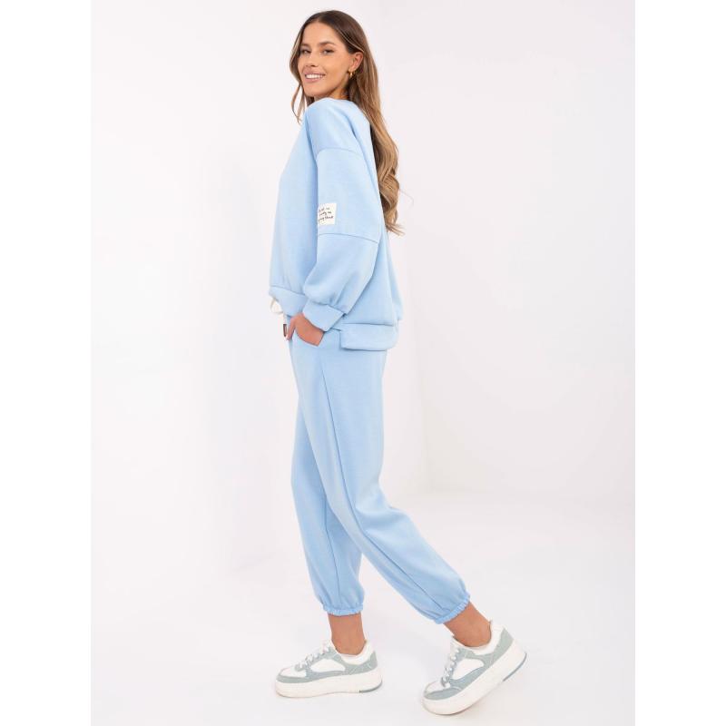 Světle modrá tepláková souprava se spodním dílem joggerů
