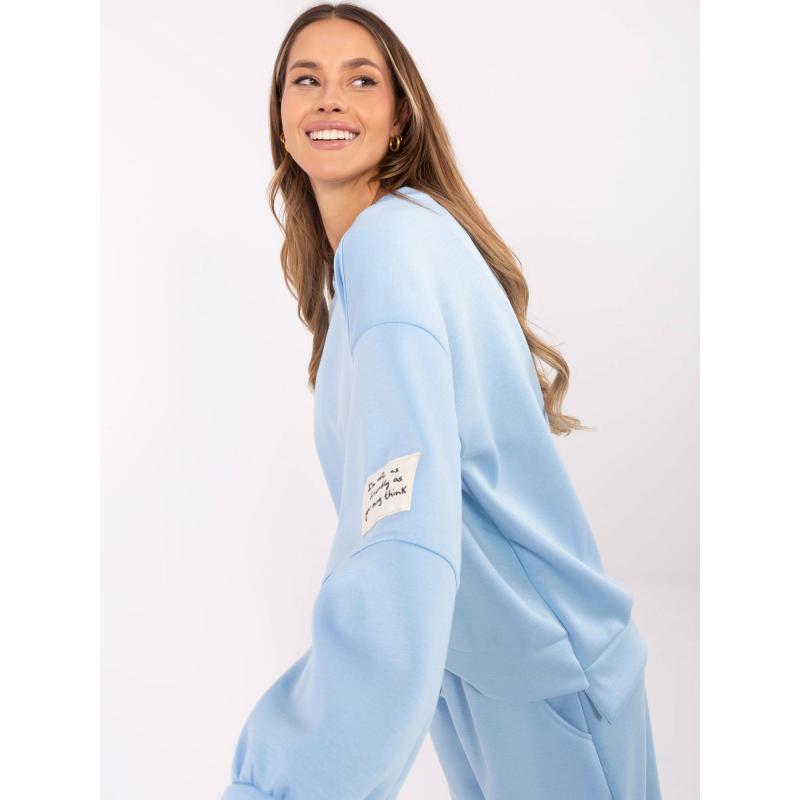 Světle modrá tepláková souprava se spodním dílem joggerů