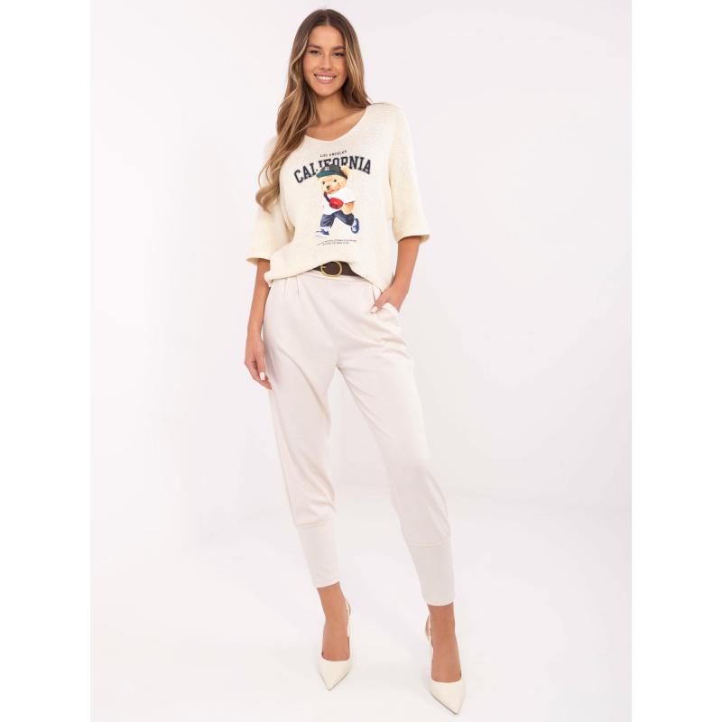 Světle béžové dámské tepláky s laclem