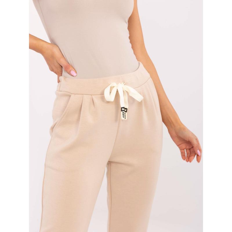 Béžové dámské tepláky s vázáním