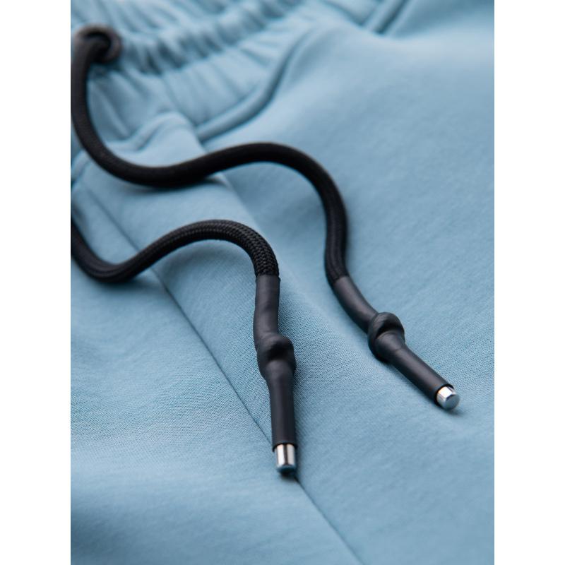 Férfi melegítőnadrág bordás szegéllyel és díszes cipzárral - világoskék V4 OM-PASK-0226