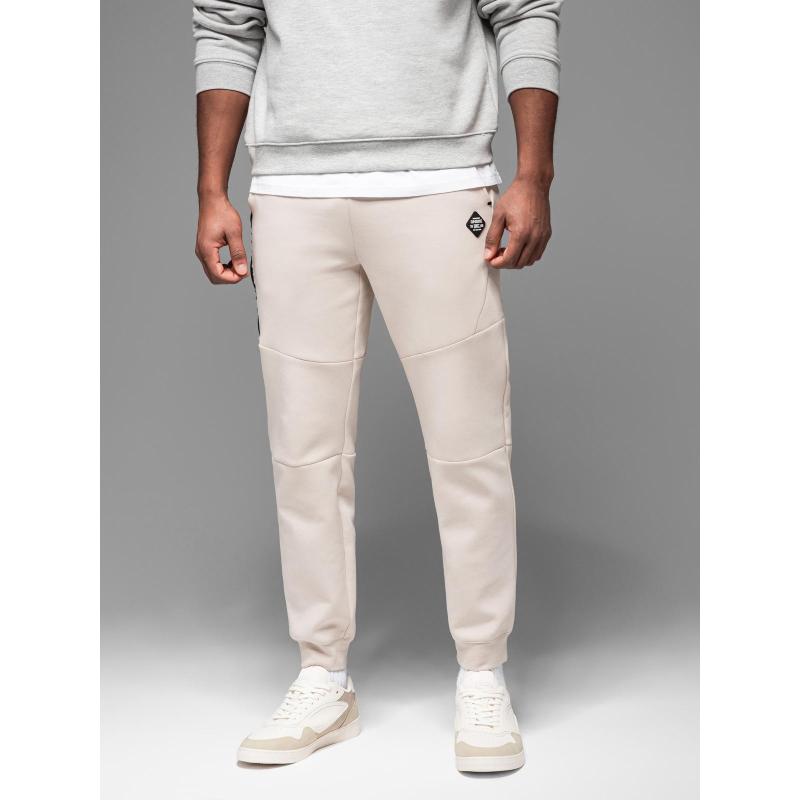 Pánské tepláky s žebrovanými manžetami a ozdobným zipem - pískové V6 OM-PASK-0226