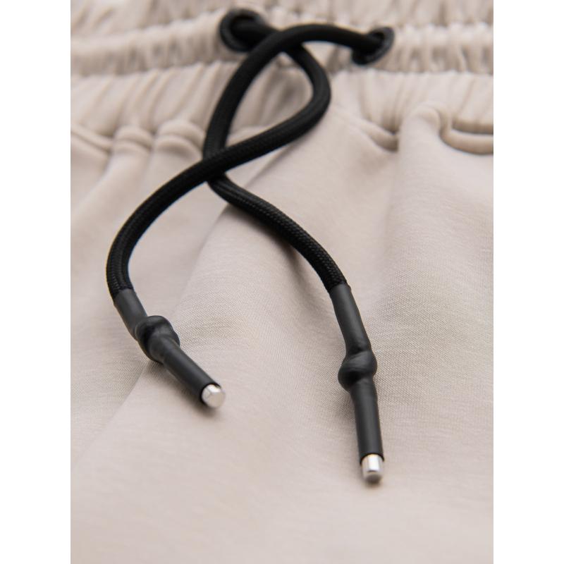 Pánské tepláky s žebrovanými manžetami a ozdobným zipem - pískové V6 OM-PASK-0226