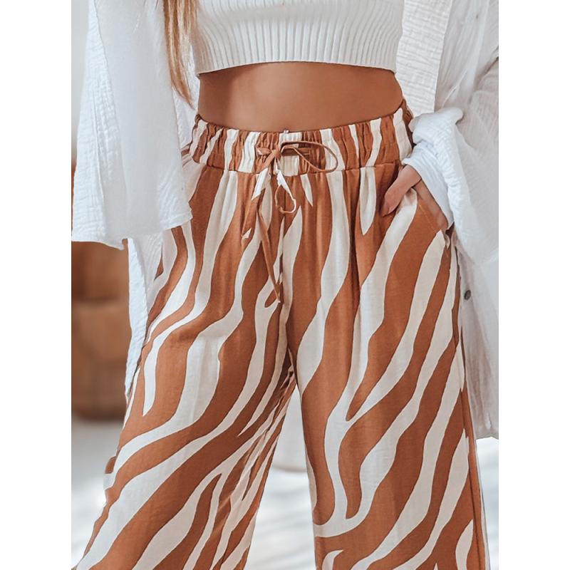 Dámské pruhované kalhoty se širokými nohavicemi ZEBRAVIBE béžovo-černé