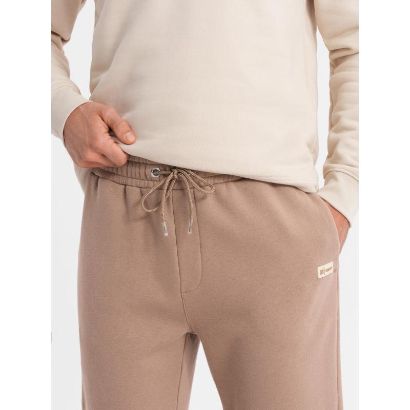 Pánské strukturované úpletové tepláky - hnědé V5 OM-PASK-0211