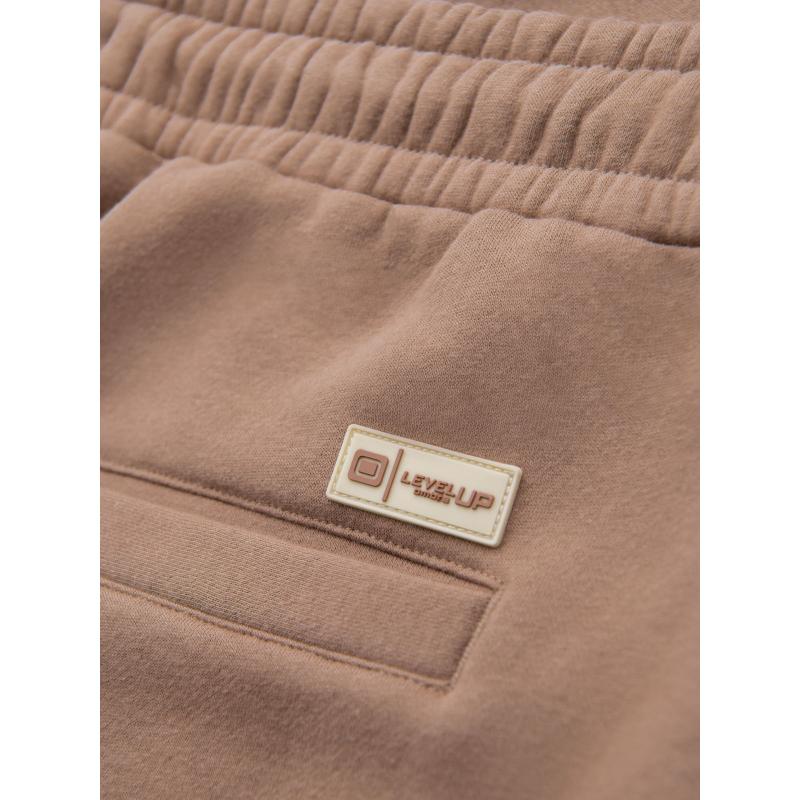 Pánské strukturované úpletové tepláky - hnědé V5 OM-PASK-0211