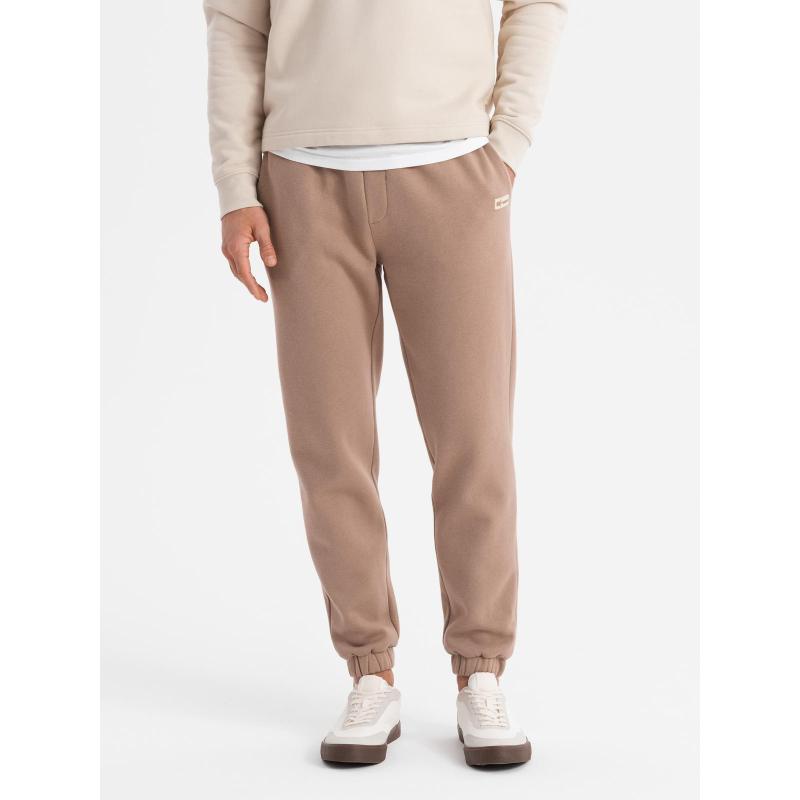 Pánské strukturované úpletové tepláky - hnědé V5 OM-PASK-0211