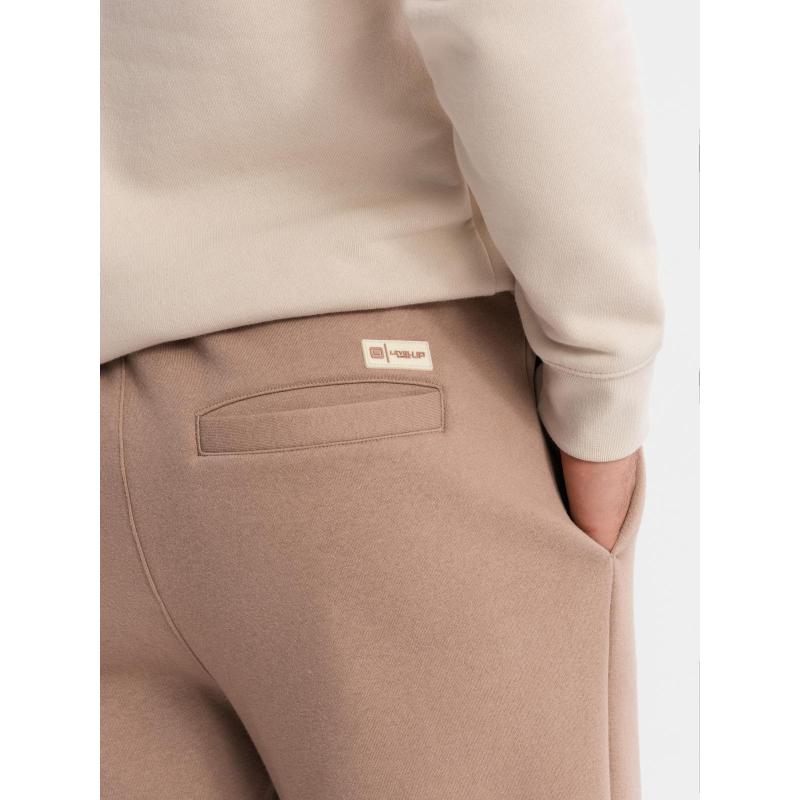 Pánské strukturované úpletové tepláky - hnědé V5 OM-PASK-0211