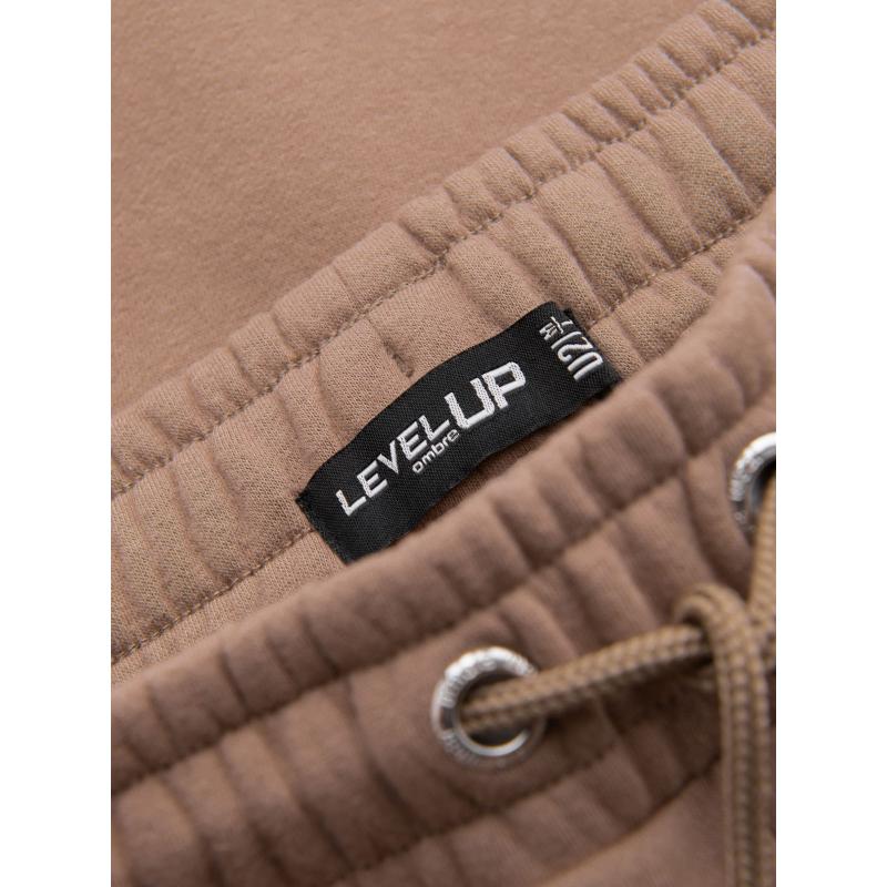 Pánské strukturované úpletové tepláky - hnědé V5 OM-PASK-0211