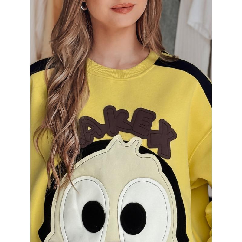 Női oversize pulóver CUTE MAKEX felvarrókkal sárga