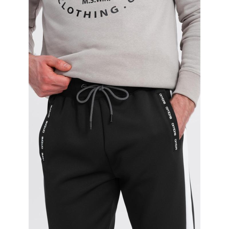 Férfi melegítő nadrág bordás mandzsettával és díszítő cipzárral - homok V6 OM-PASK-0226