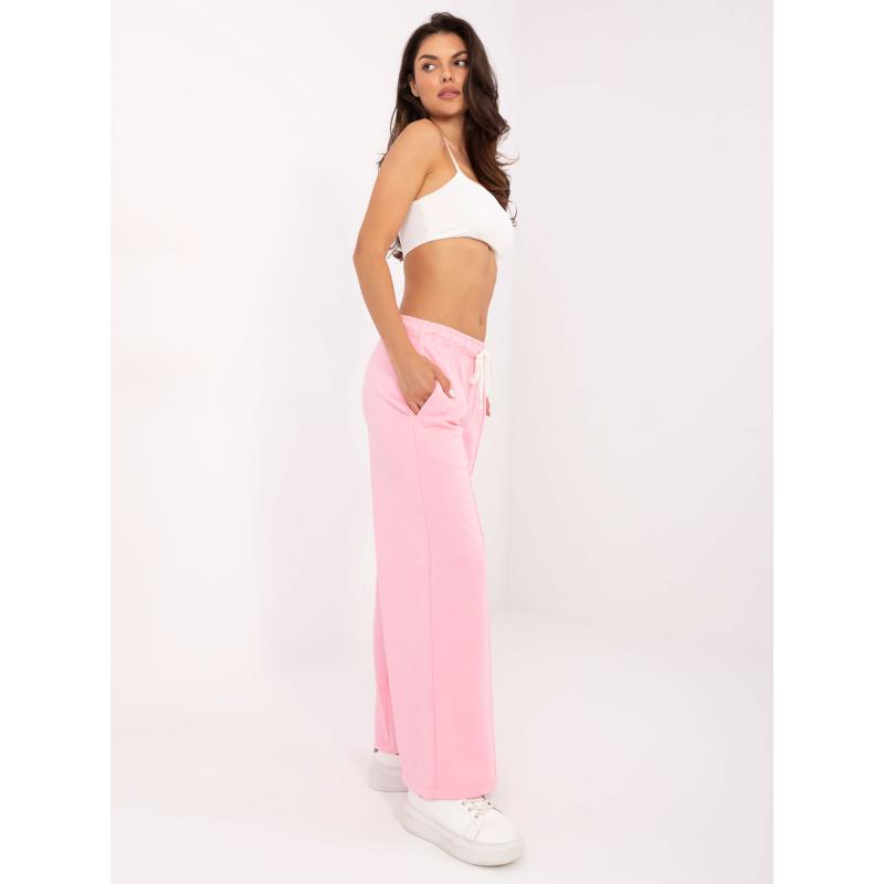 Világos rózsaszín melegítő nadrág varrással