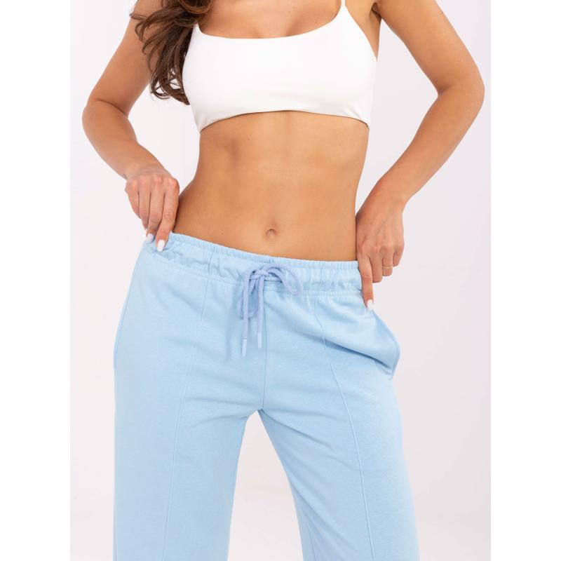 Světle modré tepláky s kapsami