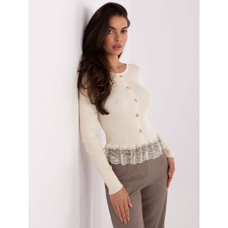 Vajas női pulóver volánokkal az alsó szegélyén