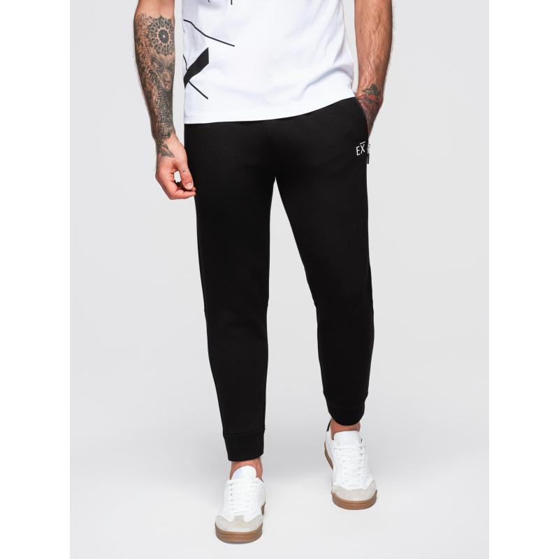 Pánské tepláky s žebrovanými nohavicemi a gumovým potiskem – černé V1 OM-PASK-0223