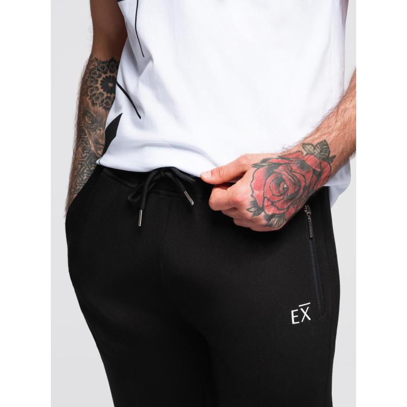 Pánské tepláky s žebrovanými nohavicemi a gumovým potiskem – černé V1 OM-PASK-0223