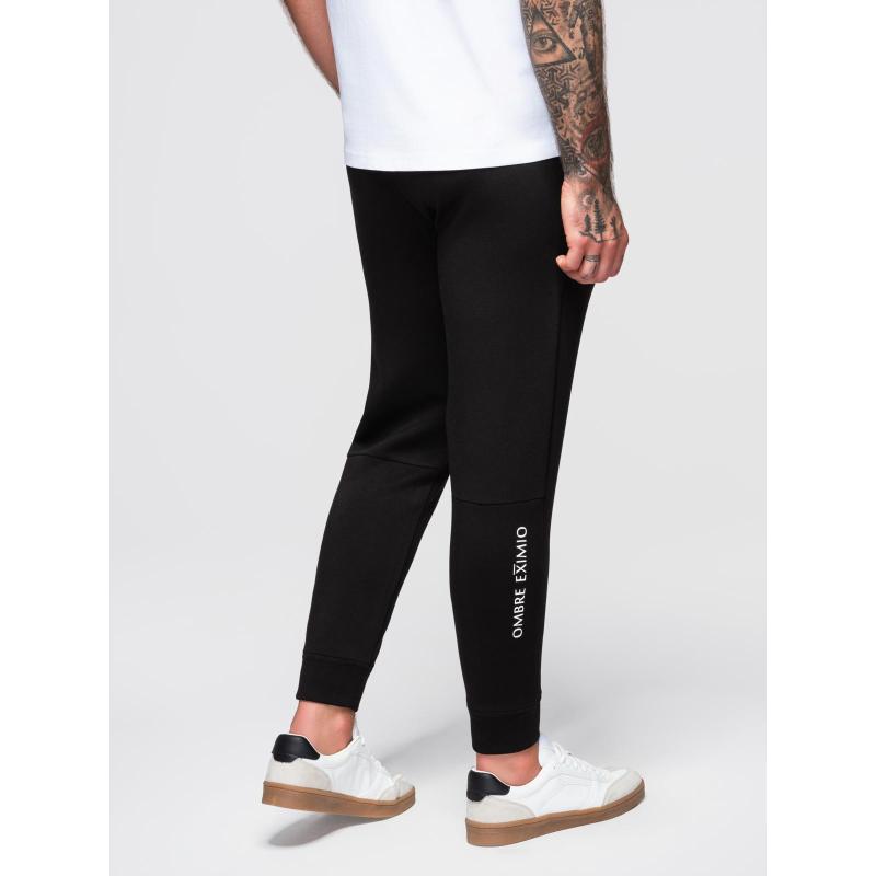 Pánské tepláky s žebrovanými nohavicemi a gumovým potiskem – černé V1 OM-PASK-0223