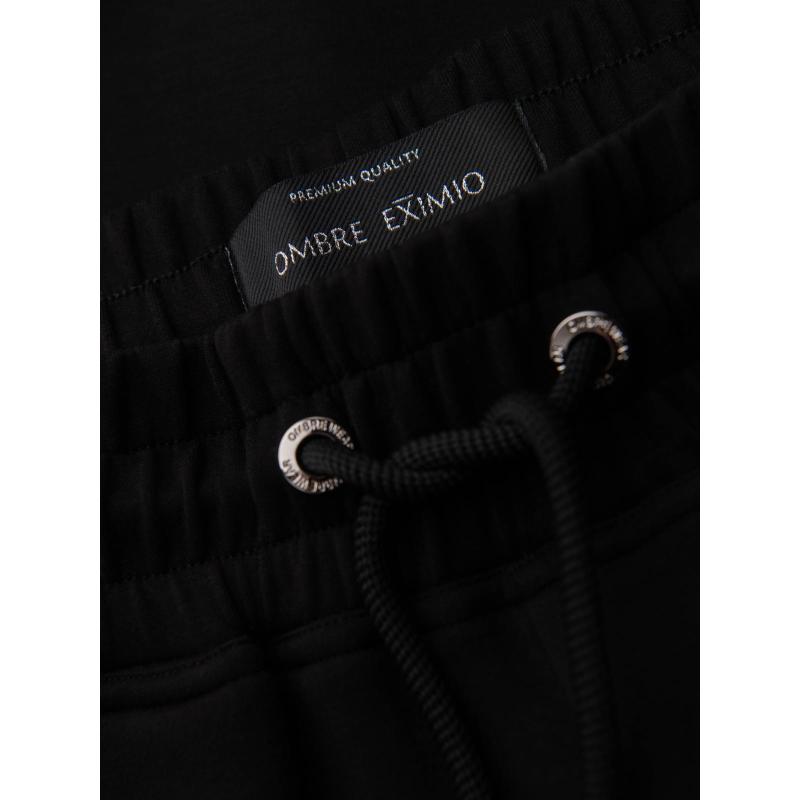 Pánské tepláky s žebrovanými nohavicemi a gumovým potiskem – černé V1 OM-PASK-0223