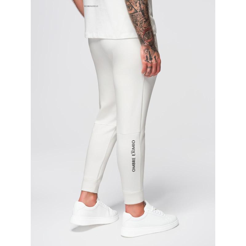 Pánské tepláky s žebrovanými nohavicemi a gumovým potiskem – bílé V2 OM-PASK-0223