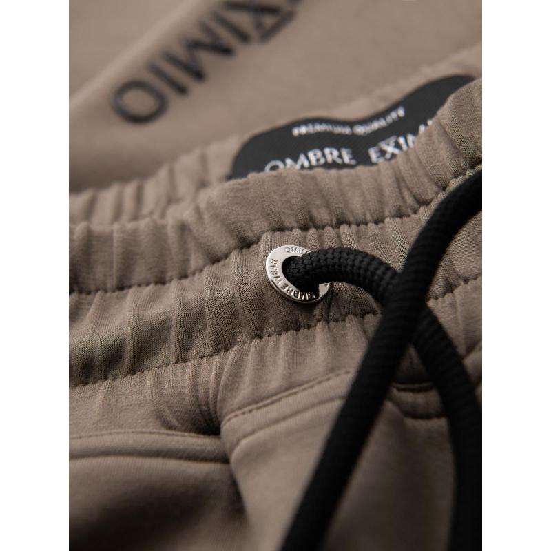 Férfi melegítőnadrág bordás szárral és gumibélyegzéssel – hamuszürke V3 OM-PASK-0223