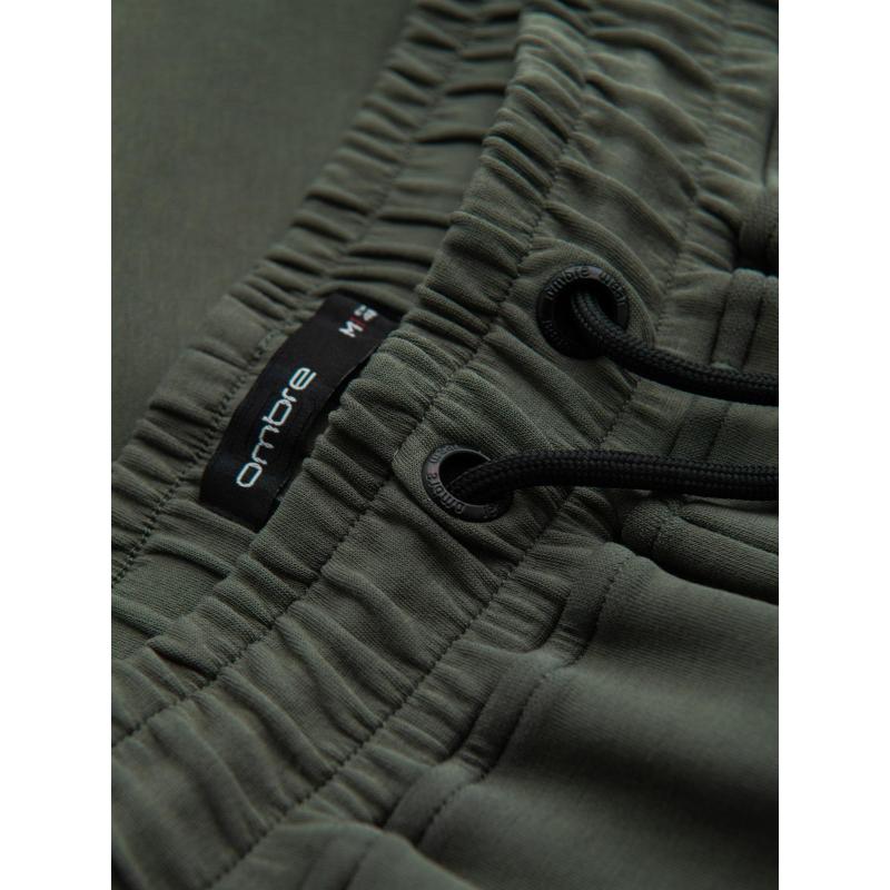 Pánské tepláky s rovnými nohavicemi a gumovými detaily – tmavě olivově zelené V4 OM-PASK-0281