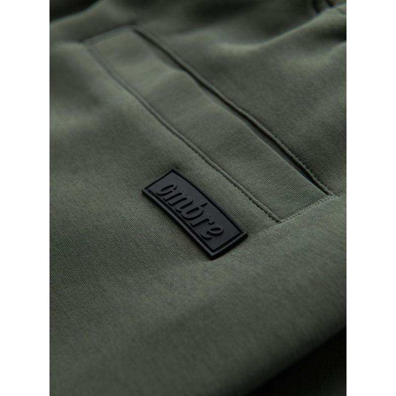 Pánské tepláky s rovnými nohavicemi a gumovými detaily – tmavě olivově zelené V4 OM-PASK-0281