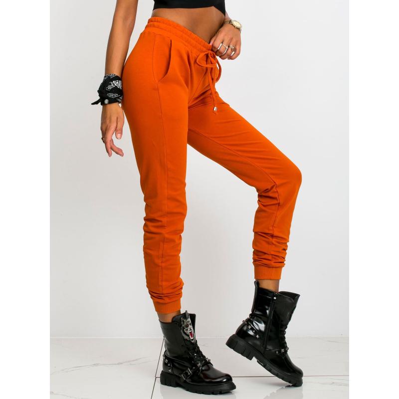 Dámske tepláky FASTER tmavo oranžové